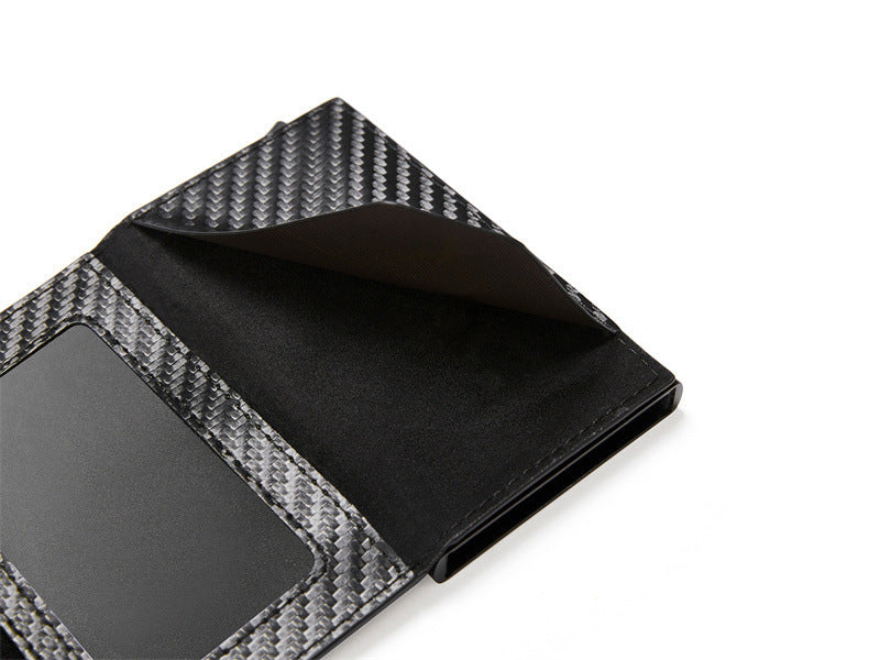 Handmade leather card-holder with knuckle made of carbon 2024 fibres or titanium tracking system